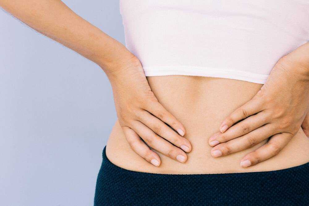 Bolest břicha před menstruací: příčiny, příznaky a léčba